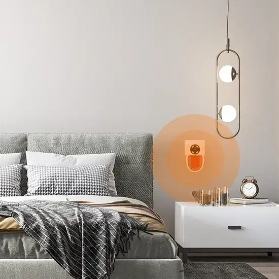 Toasty Heater warming a bedroom from a wall outlet next to the nightstand