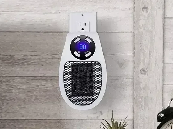 Toasty Heater plugged into a wall outlet, showing 80 degrees on its display